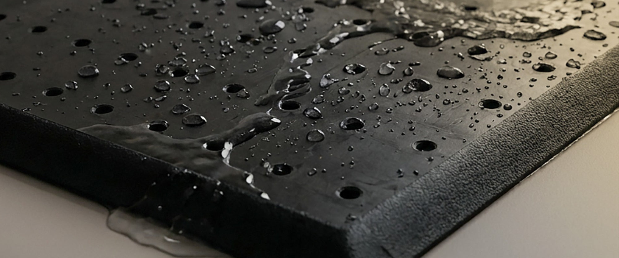 Rectangular coir refill insert placed into rubber doormat base