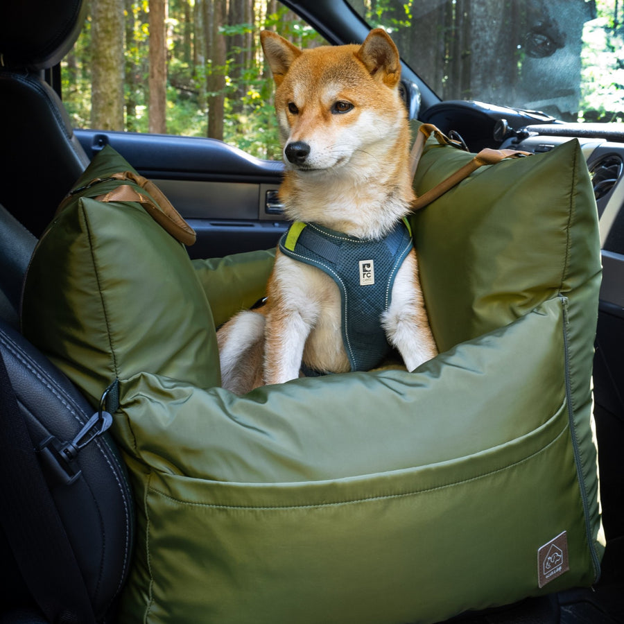 Plush cushioned pet car bed for comfortable travel