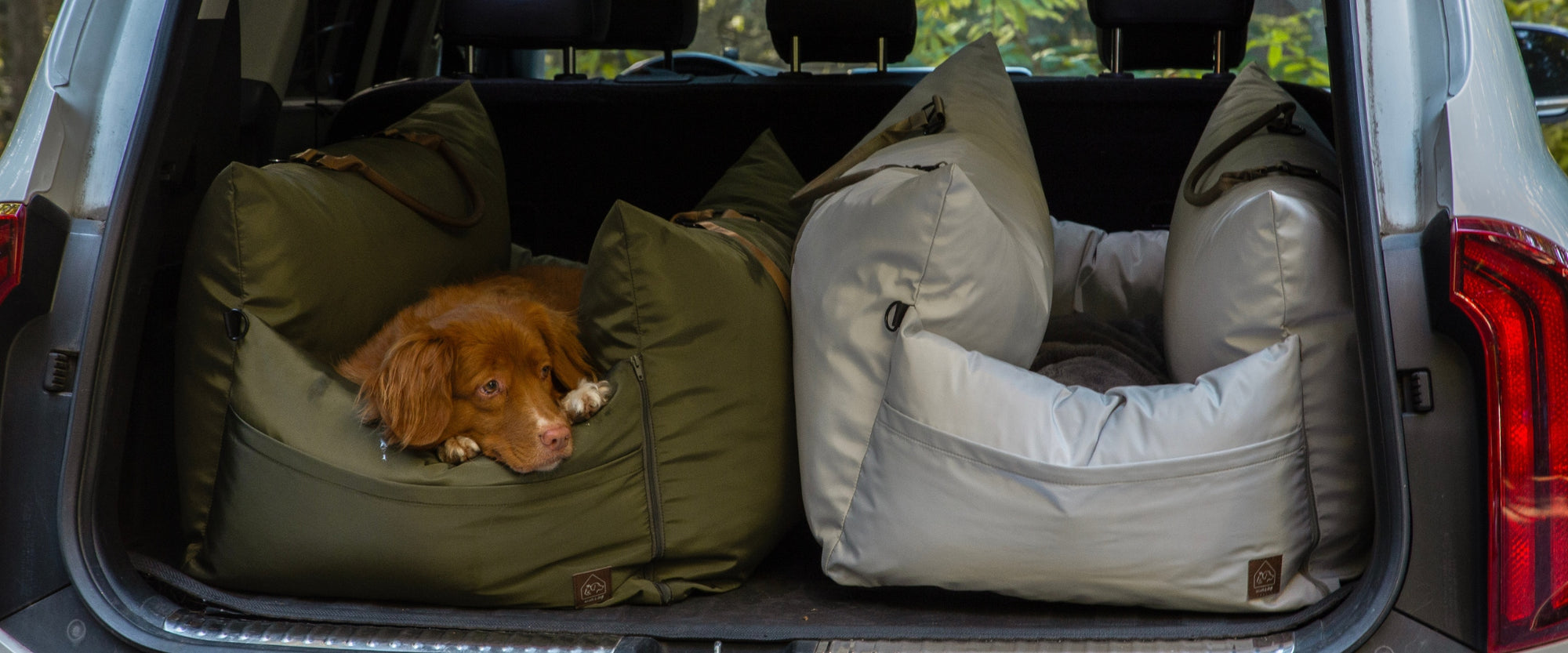 Plush cushioned pet car bed for comfortable travel